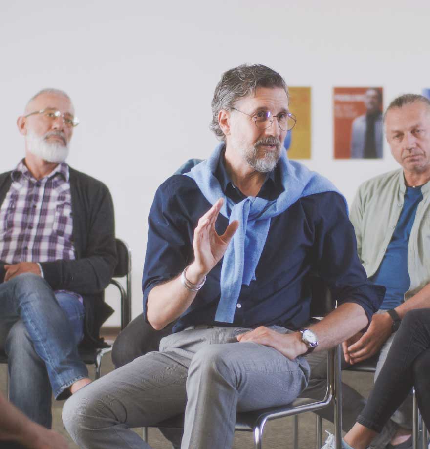Resources for Professionals A mature counselor leads a group therapy session