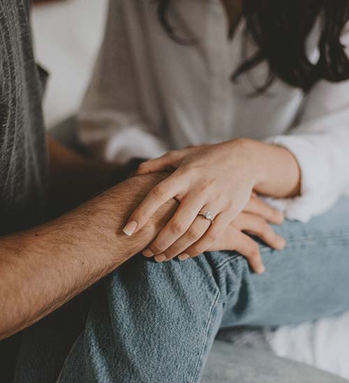 Support an Adult Family Member A married couple have a serious conversation in their kitchen